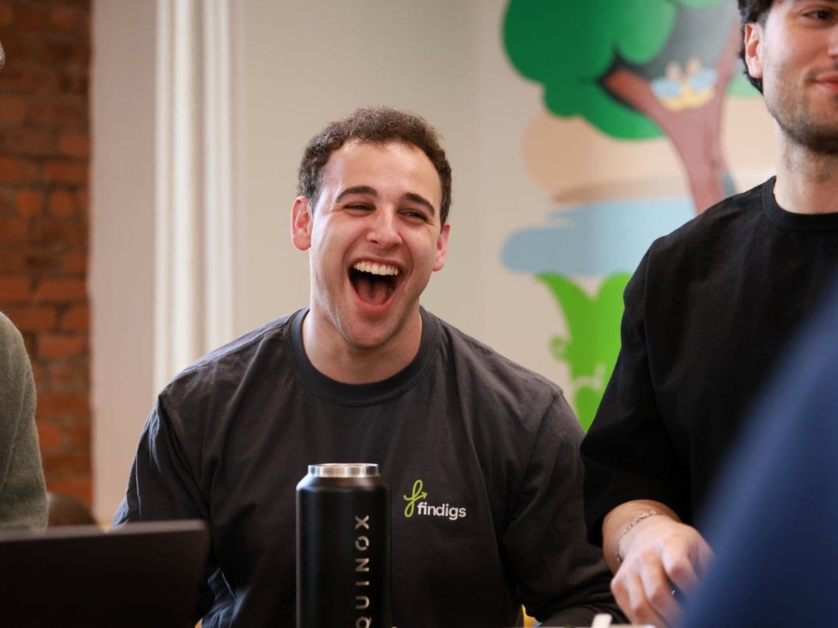 Teammates share a laugh during a break at the New York office